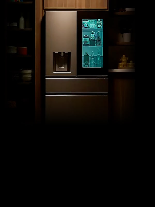 LG refrigerator installed in a kitchen with a lit door panel display illustrates MyColor, which lets the door panel color match the space and mood.