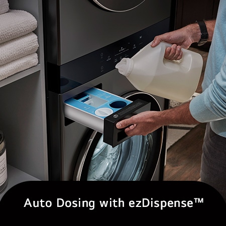 The LG WashTower WKEX300HBA in Black Steel, illustrating a user refilling the ezDispense™ Auto Dosing System, emphasizing the convenience of automatic detergent and softener dispensing.