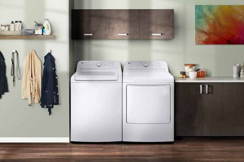 The LG Top Load Washer and Dryer set (WT6105CW) in White, showcasing its classic aesthetic and seamless side-by-side integration into a modern laundry room.