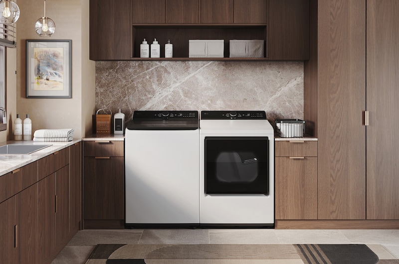 The LG Top Load Washer and Dryer set (WT8400CW) in White, showcasing the flat-top design and clean finish integrated perfectly beneath the upper cabinetry.