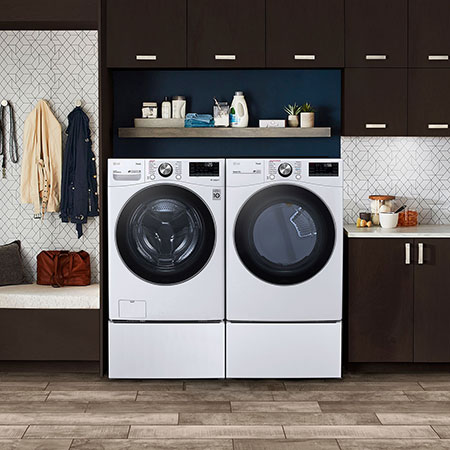 The LG Front Load Washer and Dryer set (DLEX4200W) in White, showcasing its classic aesthetic and seamless side-by-side integration on pedestals in a modern laundry room.