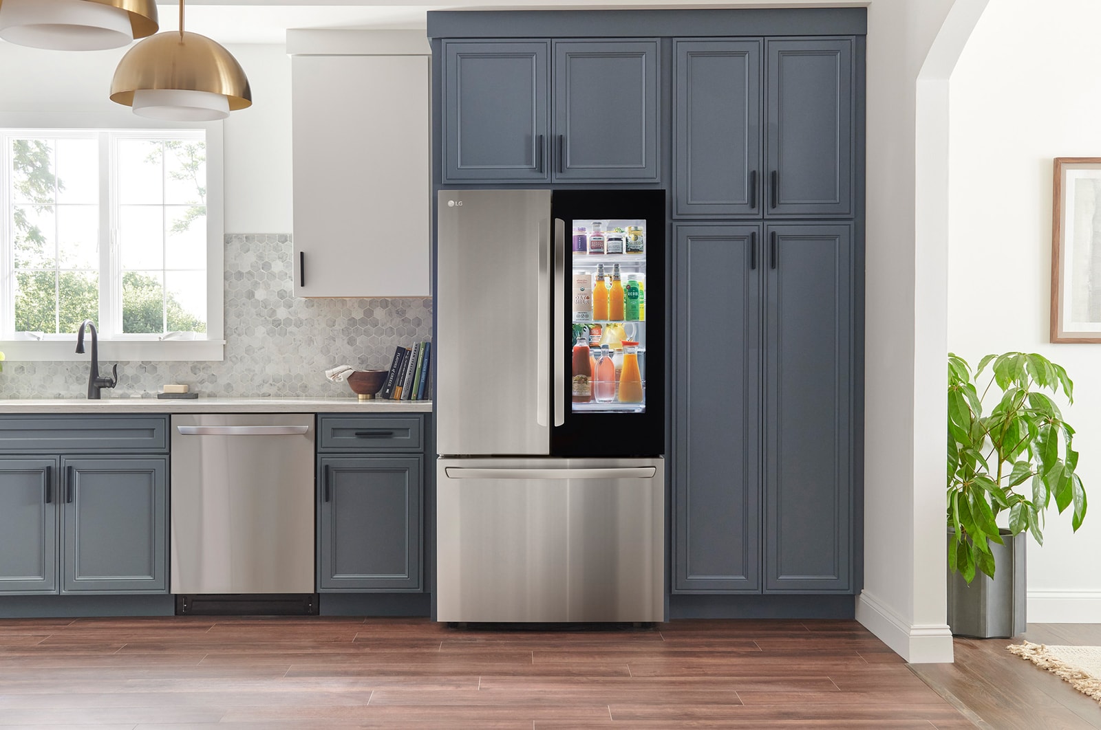 The PrintProof™ Stainless Steel LG 36-inch 27 cu.ft. French Door Refrigerator LRFGC2706S with InstaView™ Door-in-Door®, shown in a modern kitchen.