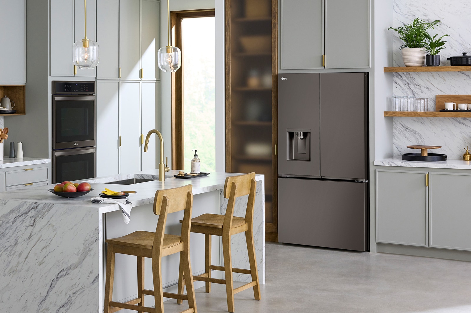 The PrintProof™ Black Stainless Steel LG 36-inch 26 cu.ft. French Door Refrigerator LRYXC2606D, shown installed in a modern kitchen.