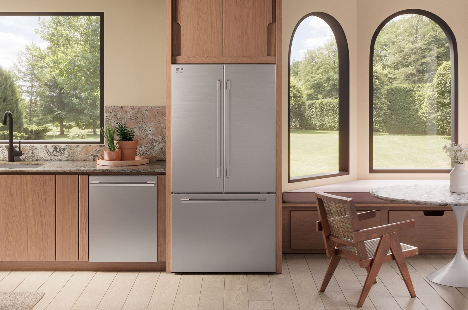 The stainless steel finish LG STUDIO 36-inch 27 cu.ft. French Door Refrigerator SRFB27S3, installed in a warm-toned modern kitchen.