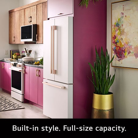 The LG STUDIO SRFB27W3 refrigerator in white with bronze handles, highlighting its Counter-Depth MAX™ design offering a built-in look with 27 cu.ft. capacity.