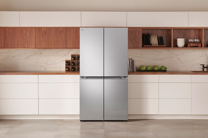 The PrintProof™ Stainless Steel LG 36-inch 24 cu.ft. Counter Depth 4-Door French Door Refrigerator LF24C8200S, shown installed in a modern kitchen.