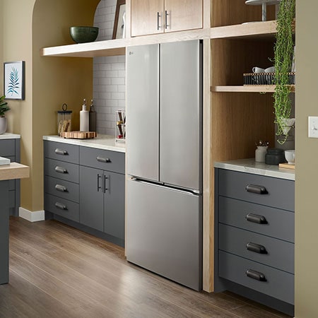 The PrintProof™ Stainless Steel LG 36-inch 25 cu.ft. Counter Depth French Door Refrigerator LF25Z6211S, shown installed in a modern kitchen.