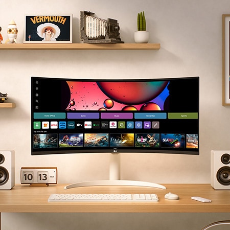 The LG Smart Monitor 34SR65QC in White displays the webOS Home Hub, seamlessly integrated into a desk setup for entertainment and streaming.