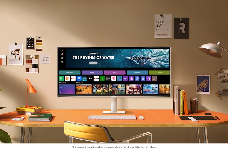 The LG Smart Monitor 34U601SA in White displays the webOS Home Hub in a stylish desk setup, ideal for productivity and entertainment.