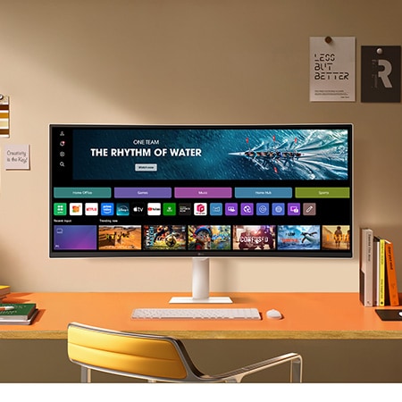 The LG Smart Monitor 34U601SA in White displays the webOS Home Hub in a stylish desk setup, ideal for productivity and entertainment.