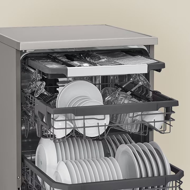 Stainless steel dishwasher with an open door showing a top cutlery tray and a middle rack filled with plates and glasses.