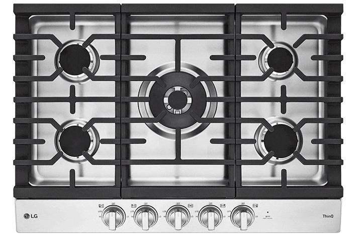 Close-up of heavy-duty black cast iron grates on a stainless steel gas cooktop.