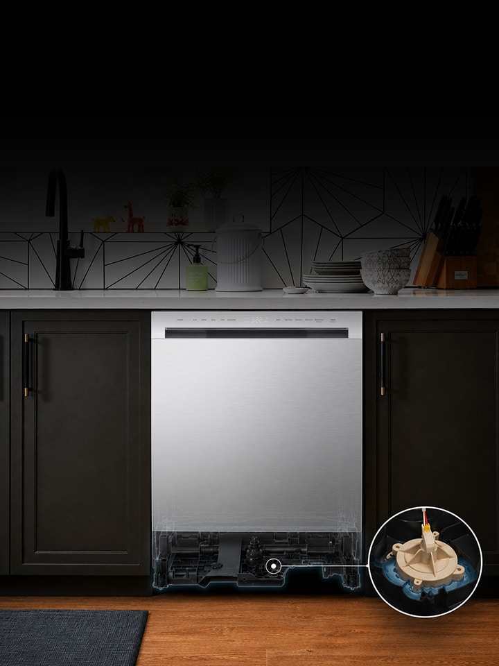 Stainless steel dishwasher installed in a kitchen with a cutaway view showing the internal leak sensor at the bottom.