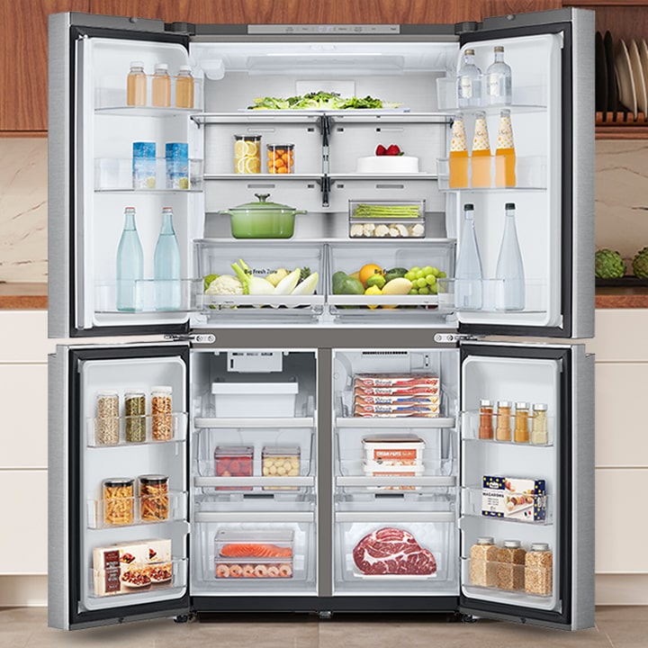 Stainless steel LG French door refrigerator with external water dispenser and bottom freezer in a modern kitchen.