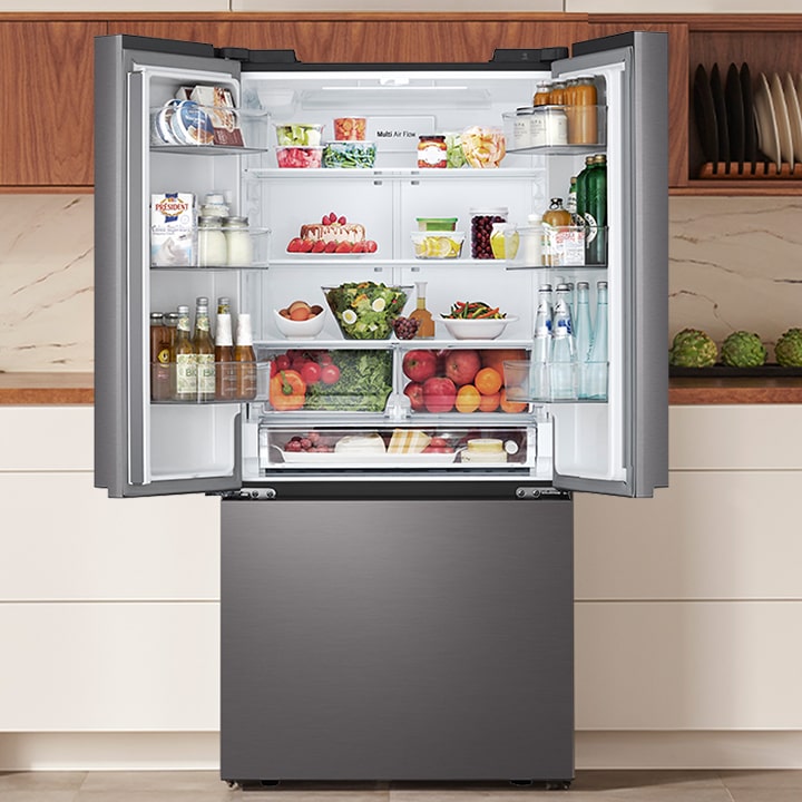 Open stainless steel French door refrigerator stocked with food, featuring a blue light highlighting the interior edges.
