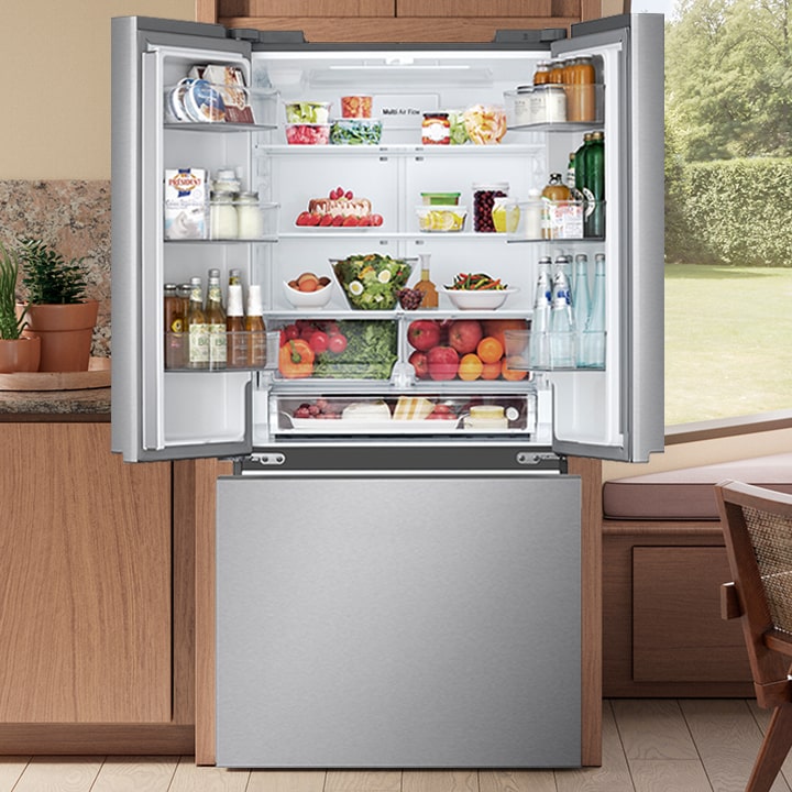 Stainless steel French door refrigerator with open top doors showing organized food, drinks, and LED lighting.