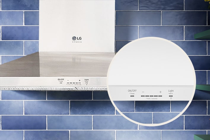 Close-up of the touch control panel on a white LG Studio range hood against a blue tiled wall.