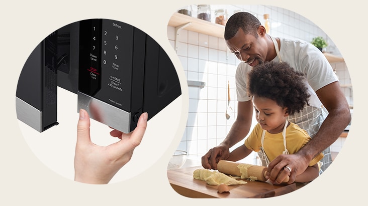 A hand pressing the child lock button on a black microwave next to a father and child baking in a kitchen.
