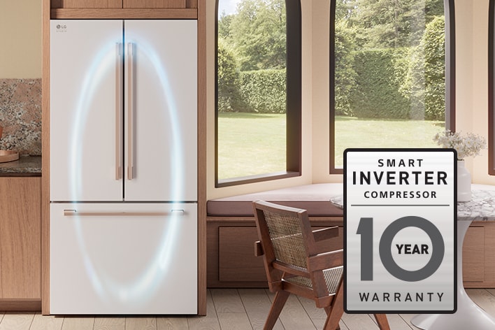 White LG French door refrigerator with rose gold handles and a 10-year smart inverter compressor warranty badge.
