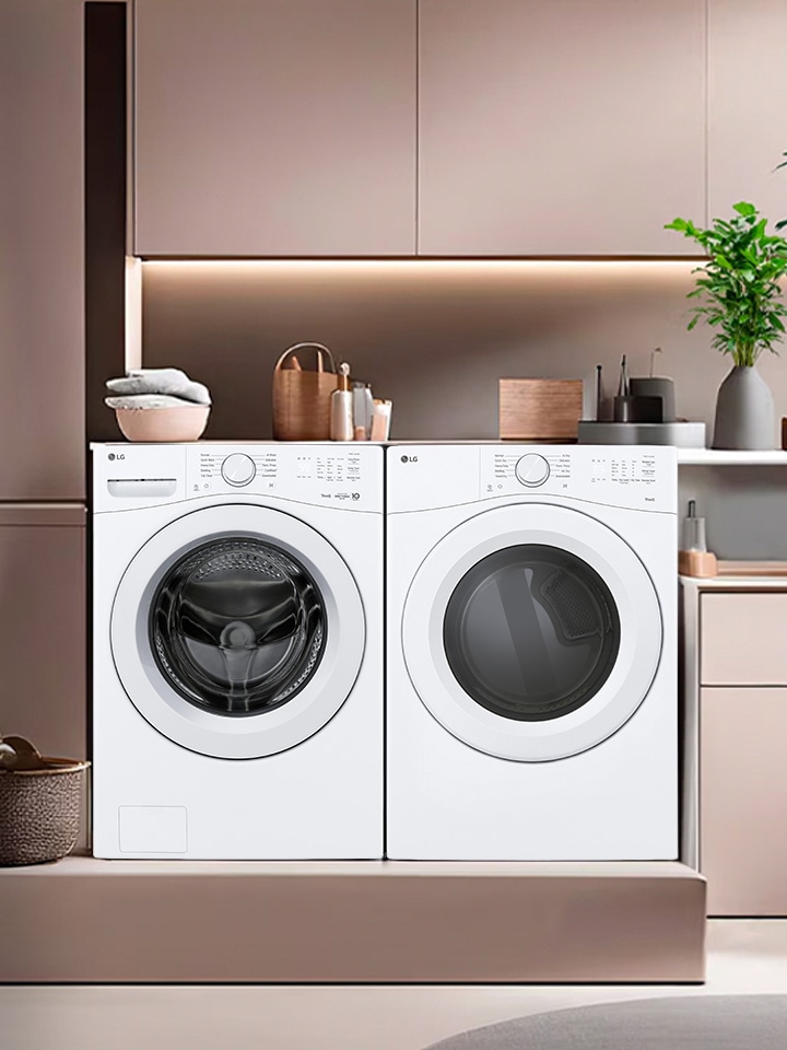 White front-load washer and dryer set integrated into a modern mauve laundry room with built-in storage.