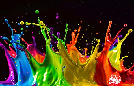 An angled overhead perspective of an LG QNED TV with an abstract, colorful artwork on screen.