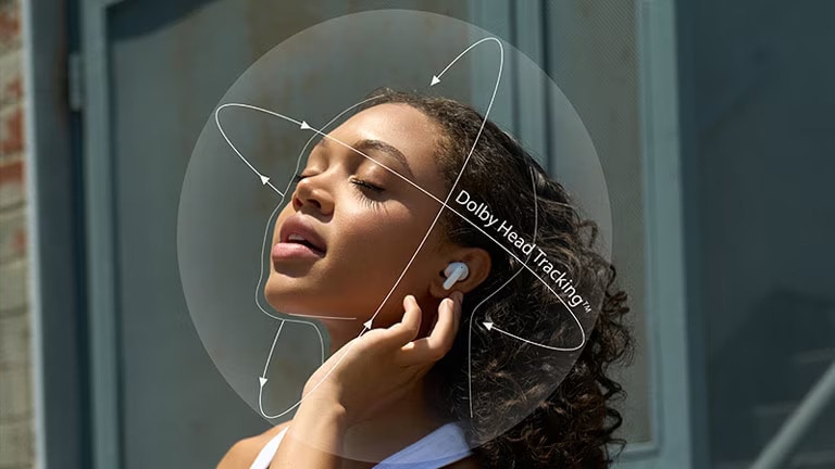 Image of women touching LG TONE Free on her ear. Showing Dolby Head Tracking function.