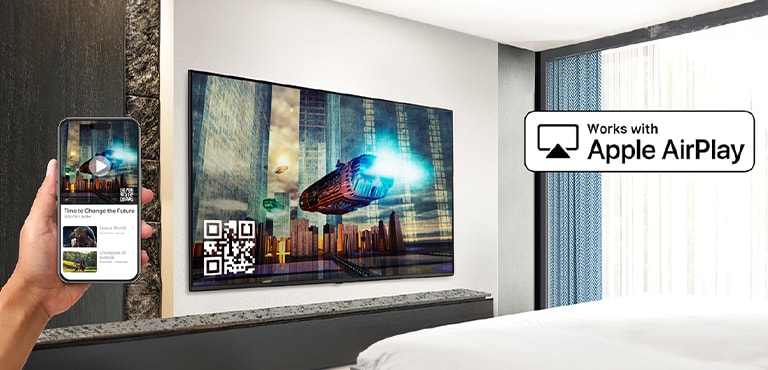 A person in the hospital room is pairing their iPhone with the in-room TV through AirPlay.