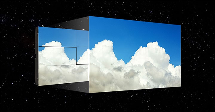 The LG MAGNIT screen, with minimal gaps between modules, shows the blue sky and puffy clouds without colour deviation.