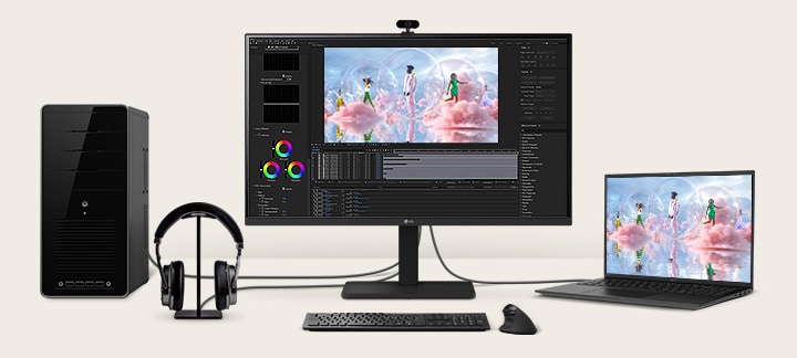 Front view showing a workstation with multiple devices connected to monitors.	
