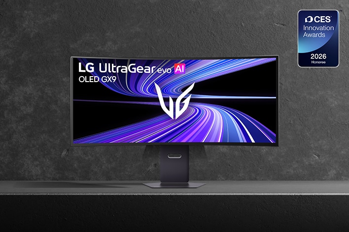 LG UltraGear evo AI 39GX950B ultrawide gaming monitor is displayed on a dark stone-textured surface. The screen shows a vivid purple and blue light-trail graphic with the UltraGear logo at the center. A CES 2026 Innovation Awards Honoree badge appears in the upper-right corner.