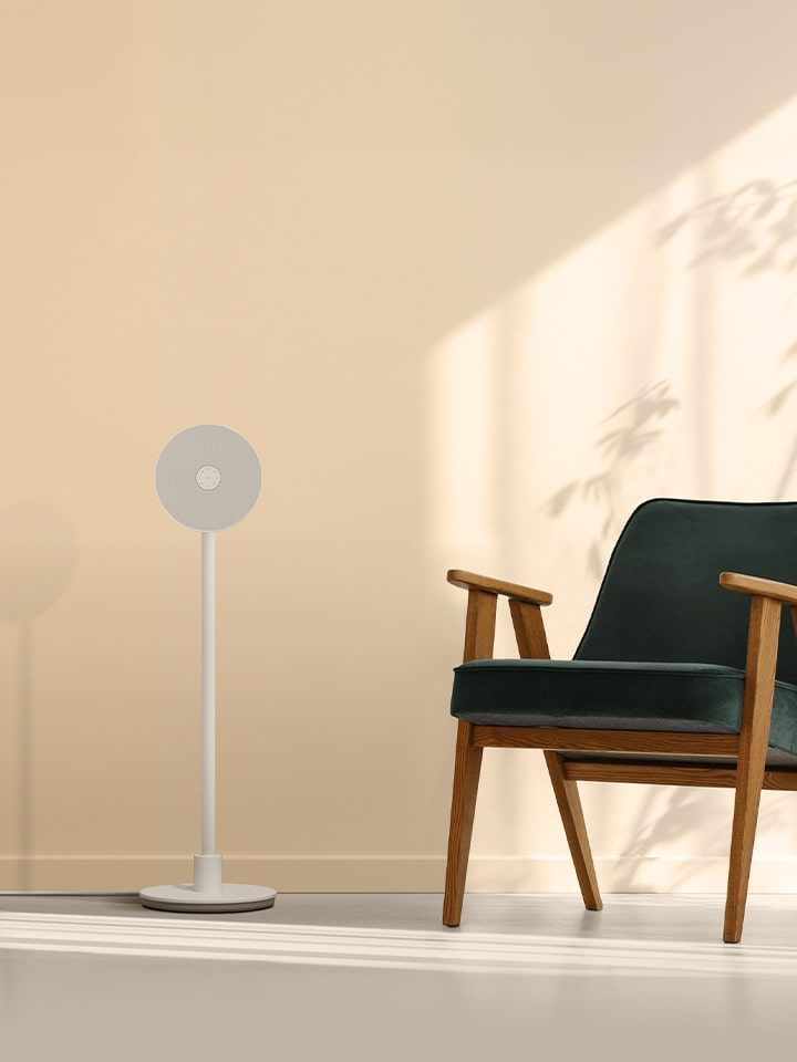 LG PF600U projector in a cozy, modern living space with a record player, minimalist furniture, and soft lighting, designed to enhance ambiance for music, movies, and relaxation.