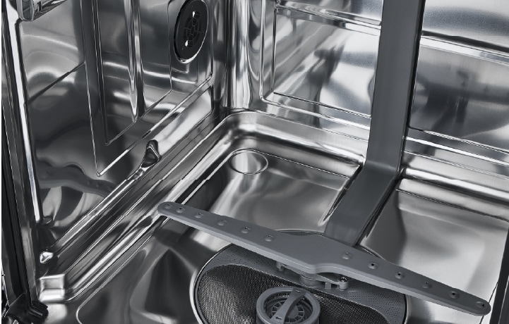 Interior view of an open white dishwasher featuring a NeverRust stainless steel tub and two loaded nylon racks.