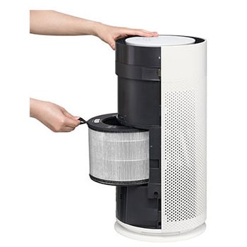 Pulling the filter forward to remove it from an LG air purifier