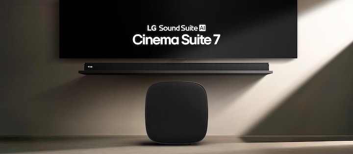 The woofer is placed upright, and the soundbar is mounted on the wall with the TV.