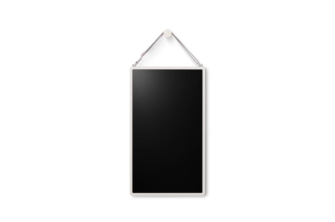 LG StanbyME 2 is hung on the wall using the wall strap.