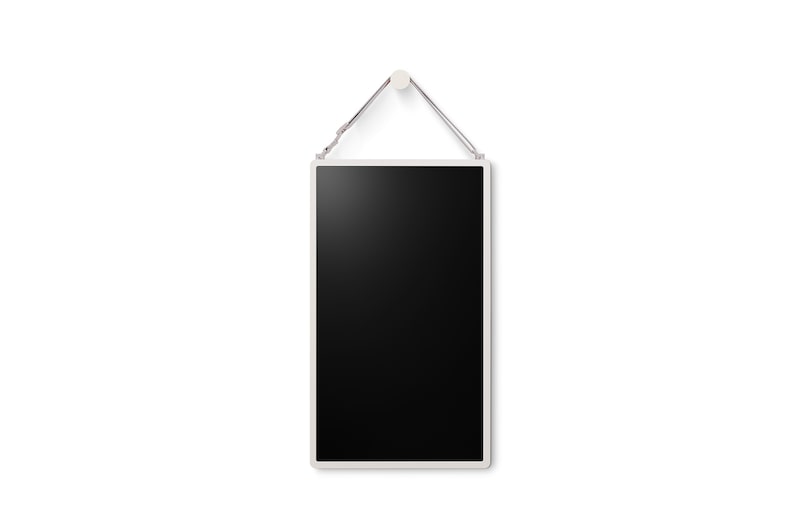 LG StanbyME 2 is hung on the wall using the wall strap.