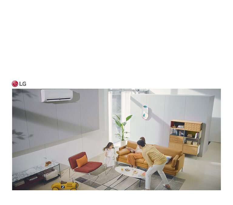 A family plays in a living room and the air condition sits in the top of the picture.