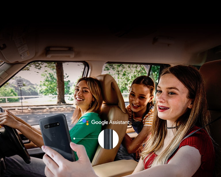 Woman searching with her smartphone in the car using google assistant function