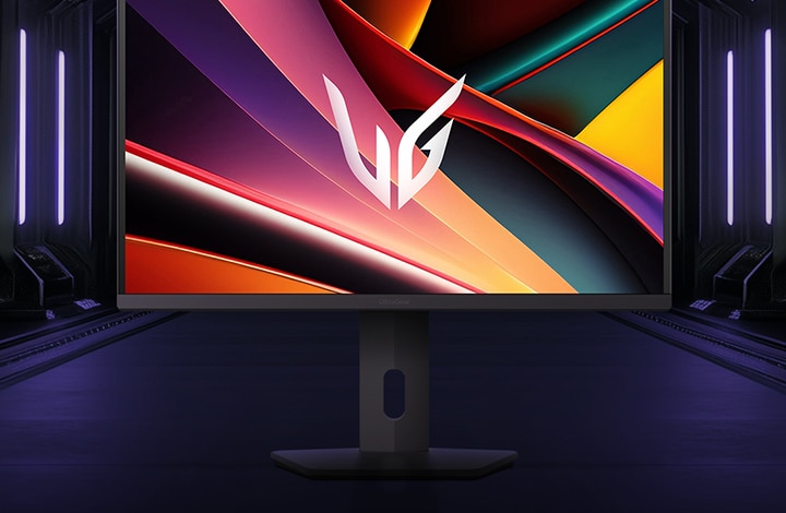 Front view of the LG UltraGear™ 27G610A gaming monitor on its hexagonal base, set in a futuristic, neon-lit corridor; the screen shows vivid purple and red swirls with the UltraGear logo at center.	