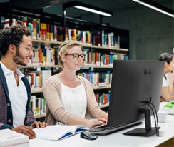 Scenes of LG full HD IPS monitor usage in the library.