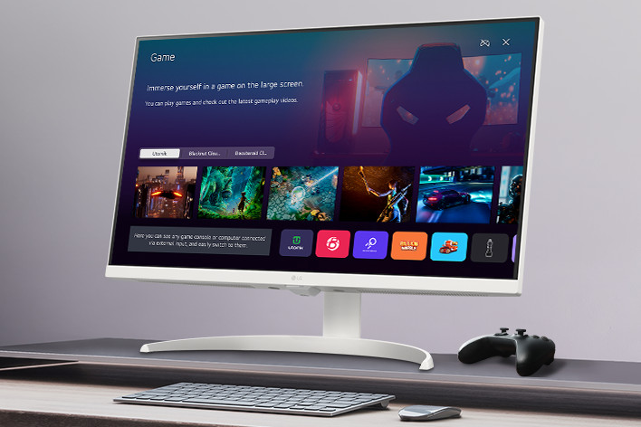 The smart monitor screen placed on the table displays the Game APP screen.