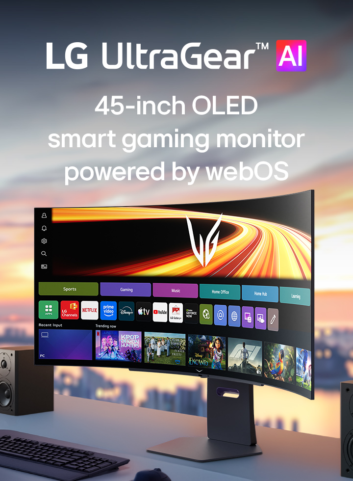 UltraGear™ GX9s OLED gaming monitor displaying the webOS interface on a curved screen, set on a desk with stereo speakers.
