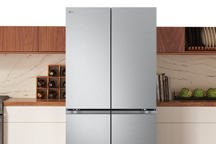 LG stainless steel four-door French door refrigerator in a modern kitchen setting.