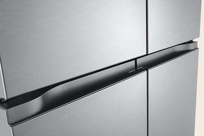 LG stainless steel four-door French door refrigerator in a modern kitchen setting.