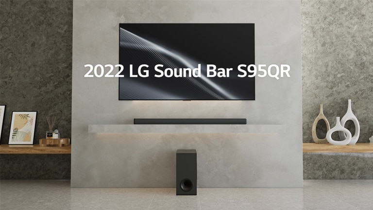 LG sound bar S95QR and LG TV are placed on the living room shelf. The TV is on, displaying a graphic image. A new wireless subwoofer is placed below the shelf.