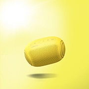 A front view of an LG XBOOM Go tilting down to its left and floating in the air
