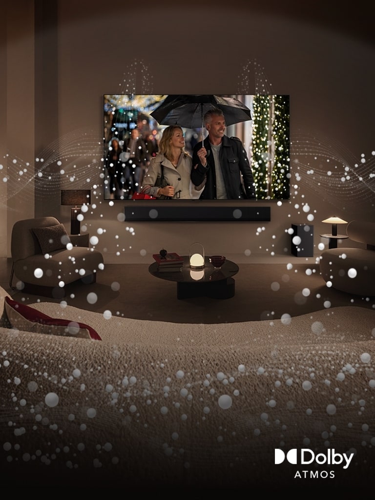 A cozy, dimly lit living space, LG OLED TV displaying a couple is using an umbrella, and bright circle graphics surround the room. Dolby Atoms logo in the bottom left corner.
