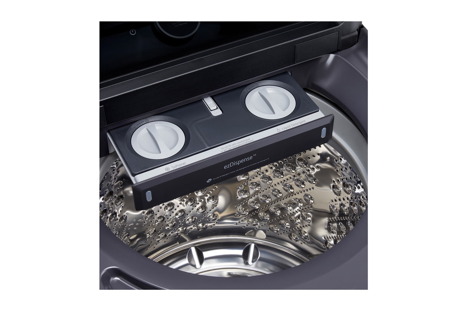 The LG Top Load Washer and Dryer set (WT8600CB) in Black Steel, showcasing its premium, side-by-side design seamlessly integrated into a luxurious laundry room with marble and wood finishes.