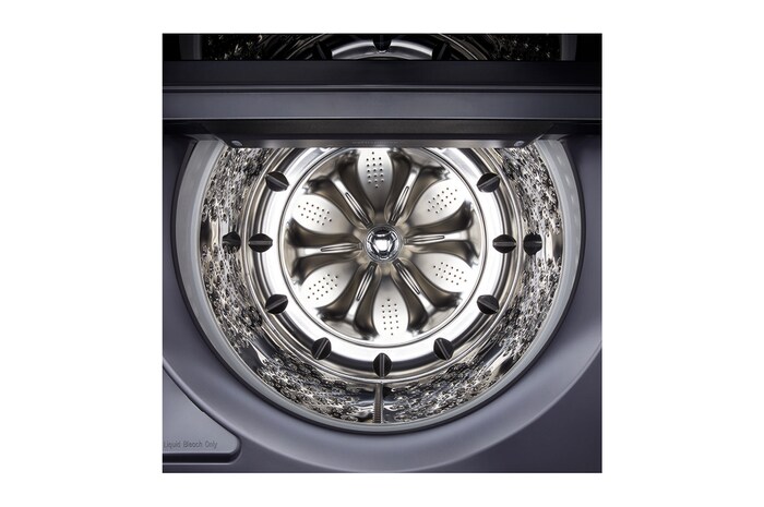 The LG Top Load Washer and Dryer set (WT8600CB) in Black Steel, showcasing the flat-top design and premium finish integrated perfectly beneath the upper cabinetry.