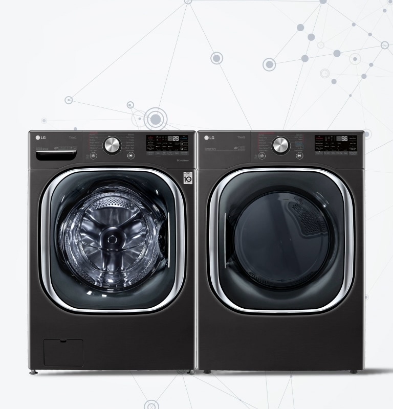 A black washer sits facing front with a stack of sweaters and blankets to the left and the AIDD logo with a light blue circle around it on top.